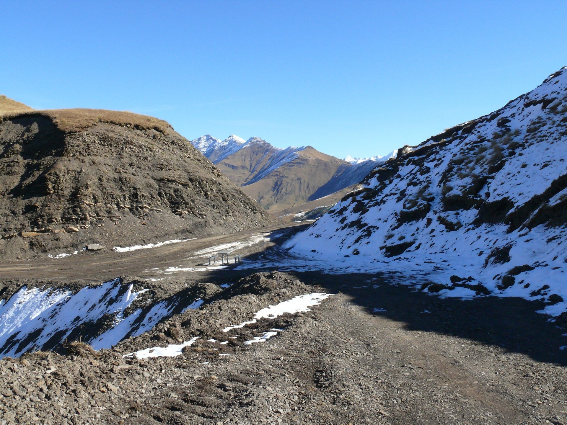 Gravel road over the Datvisjvari Pass, first snow on the slopes, October 2015
